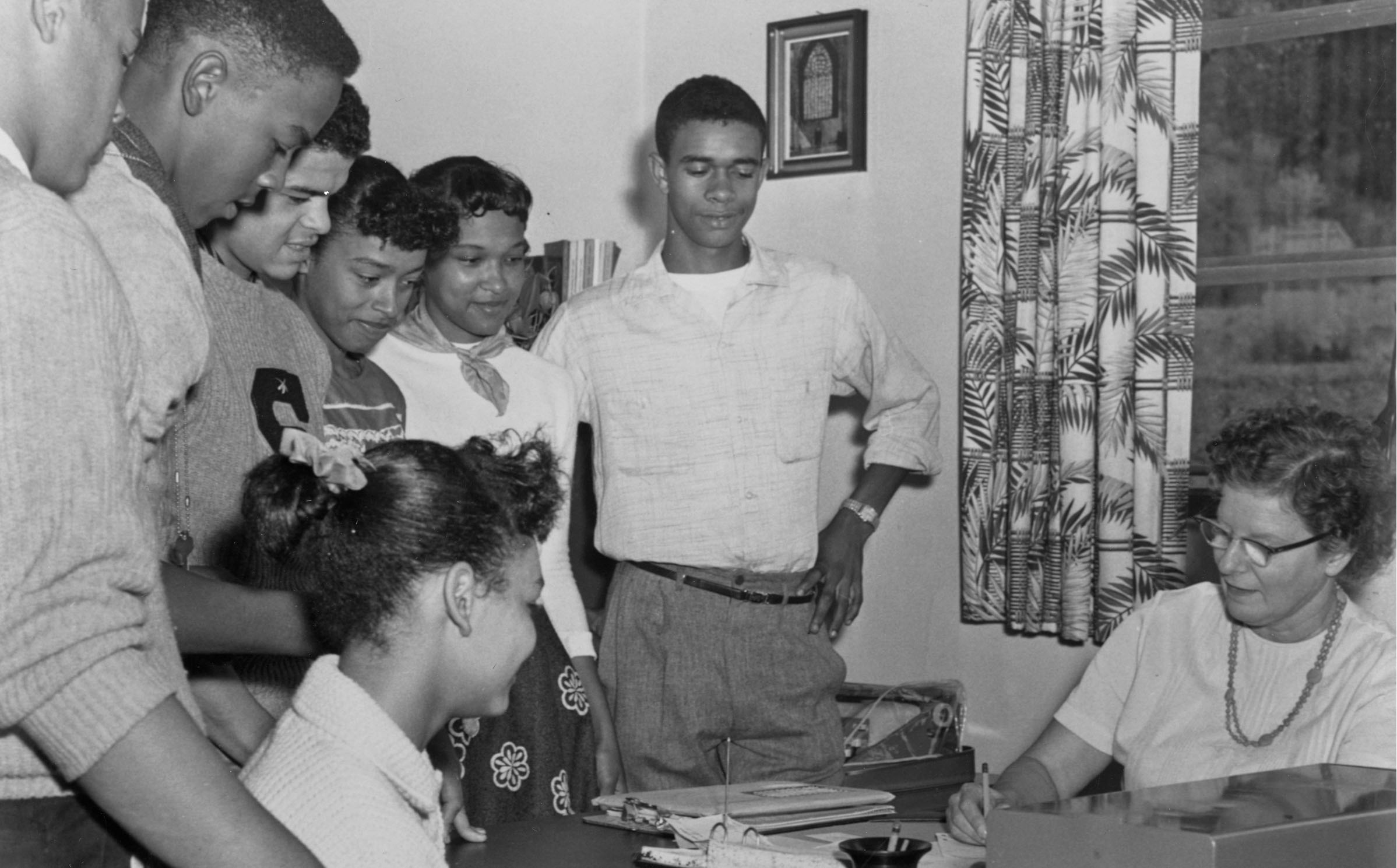 Archival photo of black students registering for classes in the 1950s